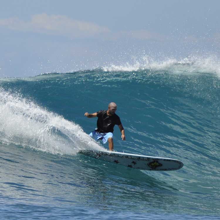 Hugo, Co-founder Of Good Feeling Surf School, Surfing A Barrel Wave